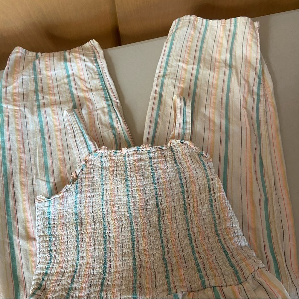 Cat & Jack hippie romper is pastel seersucker with pockets. Farm core smocking